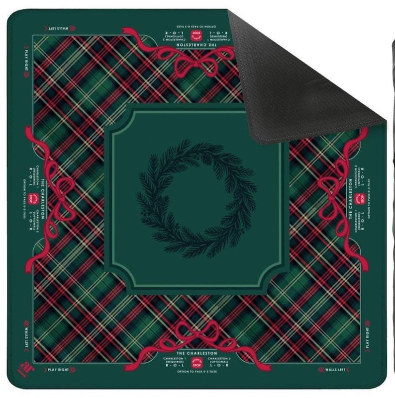 May include: A green and red plaid game mat with a central wreath design. Red ribbons and text are placed around the edges. The text reads "THE CHARLESTON" and "PLAY RIGHT".
