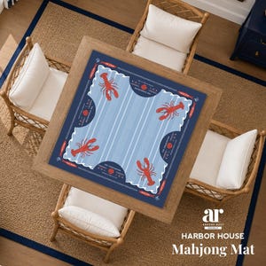 May include: A square wooden table with a blue and white striped Mahjong mat featuring red lobster illustrations. The mat is surrounded by four wicker chairs with white cushions, set on a woven rug.
