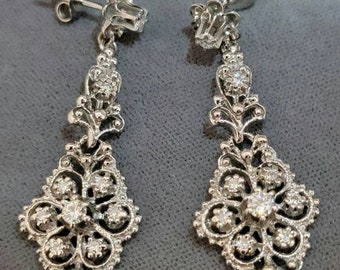 14K White Gold Pierced style Diamond Earrings in a Long Dangle style