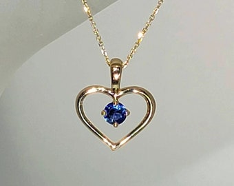 14K Yellow Gold Heart Shaped Pendant set with a Round Faceted Genuine Sapphire