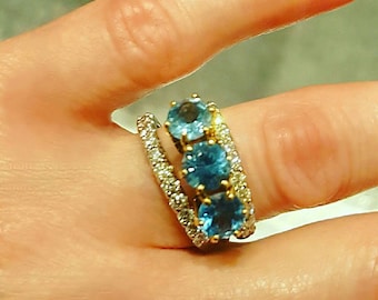 14K Yellow Gold Blue Topaz Ring. The Matching Diamond Rings are Not Included