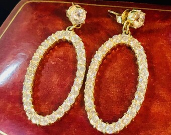 Pair of Marked 14K Yellow Gold Drop and Dangle style Pierced Earrings. Each Earring is set with Cubic Zirconia Gems throughout each Earring