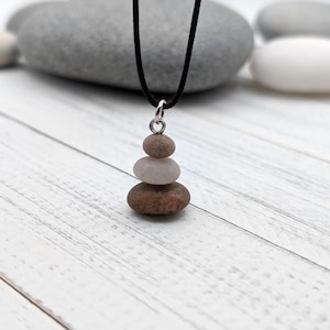 May include: A rustic wooden sign with the text "Welcome to our home" in white lettering. The sign features a distressed finish and a simple, inviting design, perfect for entryway decor.