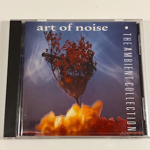 May include: A CD case with a red and orange tree on a yellow background. The text "art of noise" is in the upper left corner and "THE AMBIENT COLLECTION" is in the upper right corner.