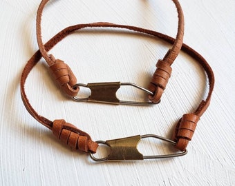 Knotted leather bracelet w/ upcycled fishing snap