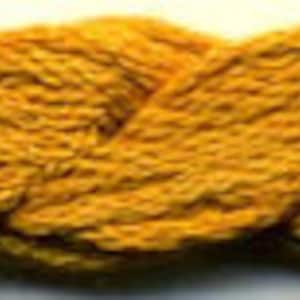 May include: A close-up of a skein of yellow yarn. The yarn is soft and fluffy, and it has a slightly textured surface.