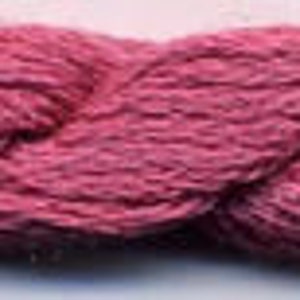 May include: A close-up of a pink yarn skein. The yarn is soft and fluffy, and it is perfect for knitting or crocheting.