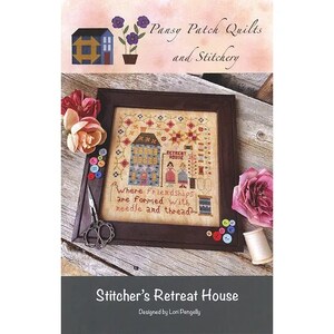 May include: A cross stitch pattern for a house with the text "Retreat House" and "Where friendships are formed with needle and thread". The pattern is titled "Stitcher's Retreat House" and designed by Lori Pengelly.