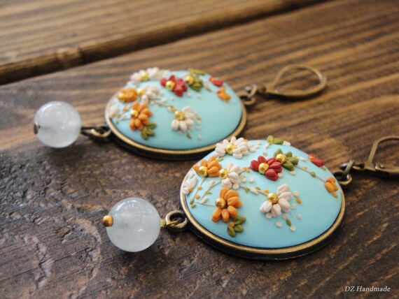 Items similar to Blue sky and flowers earrings. Handmade ...