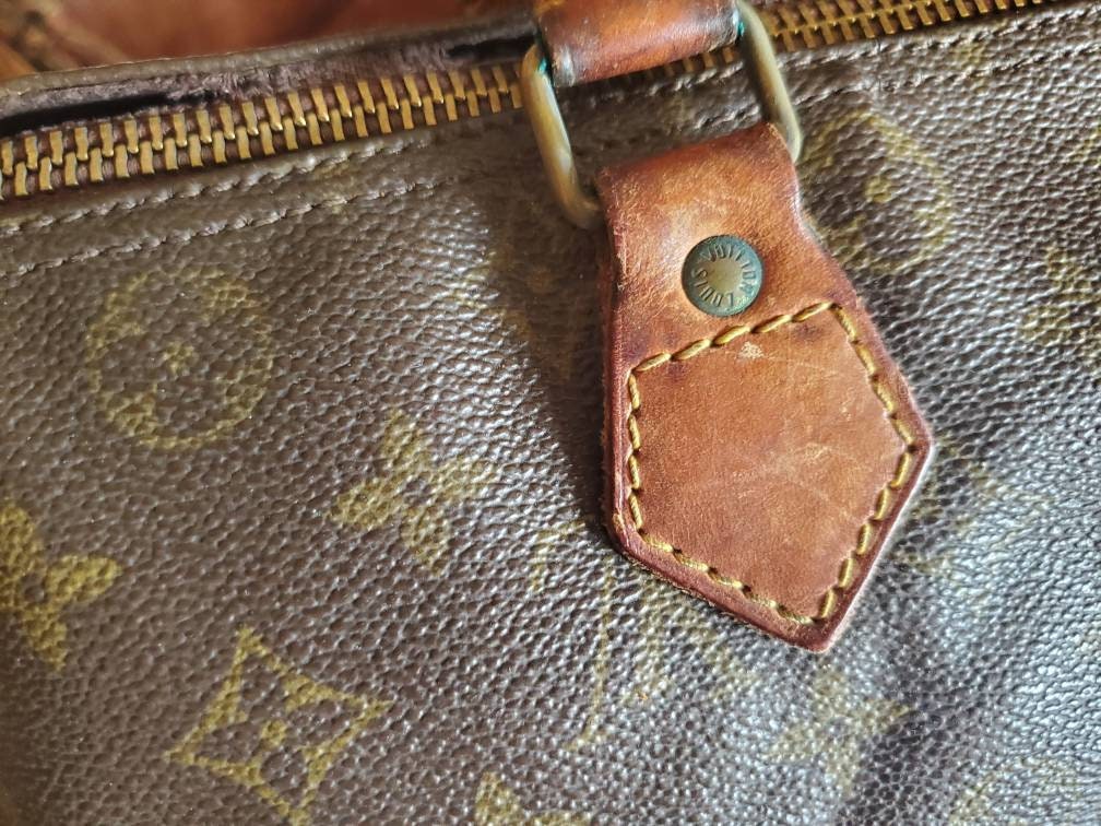 Bolso de Louis Vuitton Vintage Speedy 30 en lona monogram, en color marrón  con asas de cuero