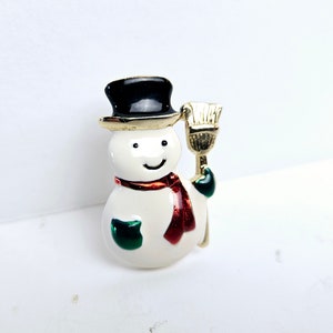 Vintage Christmas Snowman Pin White Enameled Snowman with Top Hat and Wrapped With Red Scarf Wearing Green Gloves Holding Broom Holiday Pin