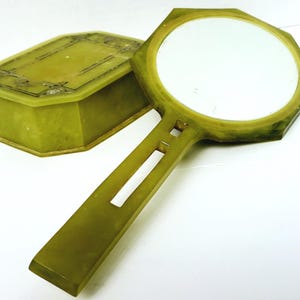 Espejo de tocador y caja de polvos de celuloide verde marmoleado estilo art déco vintage