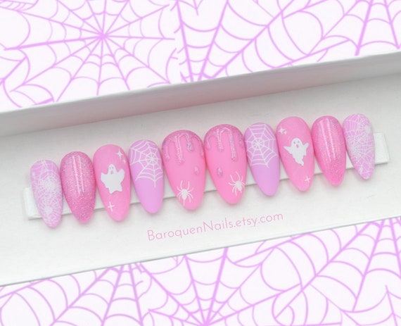 20 Halloween Nail Ideas With Ghosts, Bats and Spooky Details 3 Pink Ghosts and Glitter