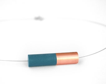 Tube necklace with a bimaterial copper and resin tube pendant on a thin cabled nylon necklace, avalaible in 18 colors, for a refined style