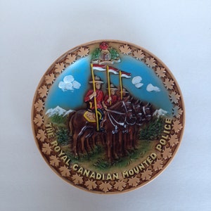 Canada Souvenir Plate w Royal Canadian Mounted Police / Mounties on Horses near Mountains  / Bright Color / Raised Pattern and Maple Leafs