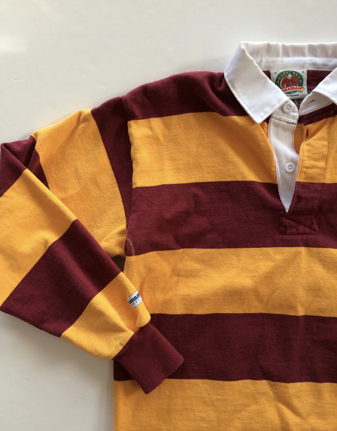 maroon and gold rugby shirt
