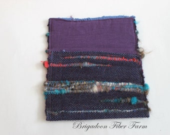 Hand woven clutch , purple linen lining, alpac art yarn, purple, teal, red