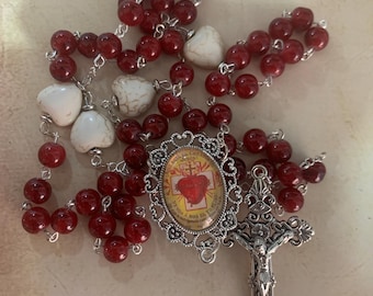 Stop! The Sacred Heart of Jesus is with me. Rosary.