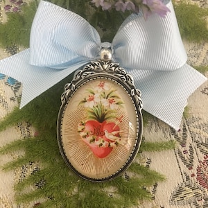 Medallon broche, Corazon de Maria.Romero Santo, Santo Romero, que salga lo malo y entre lo bueno.