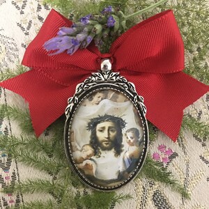 Medallion brooch, True Face of Our Lord. Holy Romero, Holy Romero, let the bad come out and the good come in.