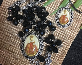 Rosary of the Holy Child Jesus of Prague and medal.