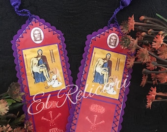May include: Two purple fabric bookmarks with a scalloped edge and a tassel. Each bookmark features a red background with a religious image and a small image of a crown and nails.