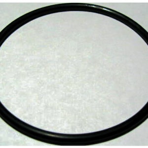 May include: A black rubber gasket or seal, likely for a pot or pan.