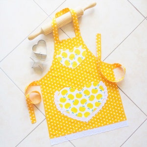 Childs/Toddlers Apron Yellow, girls lined kitchen cooking craft play cotton apron with polka dots and apples, lace heart pocket & border image 1