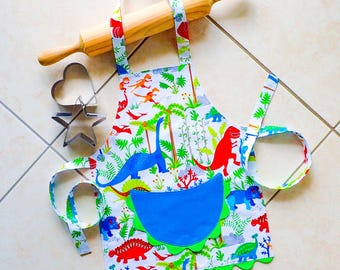 Kids/Toddlers Apron Jungle Dinosaurs, boys & girls lined cotton kitchen baking play apron with pocket, green Jurassic ric rac trimming