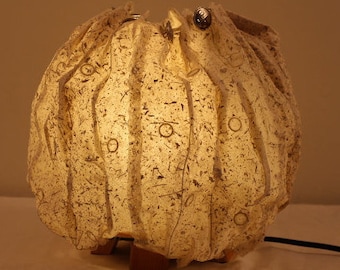Handmade paper lamp from abaca with inclusions in the paper