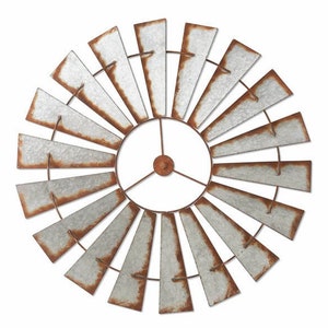 May include: A decorative metal windmill wall art piece. The windmill features a circular design with galvanized metal blades and a rusty brown trim. The blades are arranged around a central hub, creating a rustic, farmhouse aesthetic.