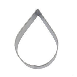 May include: A silver metal cookie cutter shaped like a teardrop.