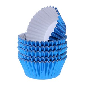 May include: A stack of blue cupcake liners, made of foil, with a scalloped edge. The liners are folded and ready to be used for baking.