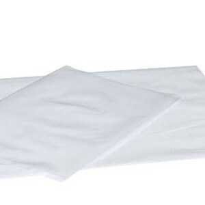 May include: Two white pillowcases are displayed on a white background. One pillowcase is folded and placed on top of the other, creating a layered effect. The fabric appears smooth and slightly translucent.