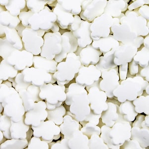 May include: White cloud-shaped sprinkles for decorating cakes and cupcakes. These small, sugar-based sprinkles are perfect for adding a touch of whimsy to any baked good.