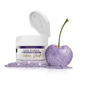 May include: A small jar of deep purple edible glitter labeled "Tinker Dust" with a cherry covered in the glitter. The jar is 100% edible food grade glitter and weighs 0.18 ounces (5g).