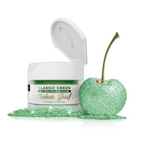 May include: A small jar of green edible glitter labeled "Classic Green 100% Edible Food Grade Glitter Tinker Dust. Net Weight 0.18oz (5g)". A green glitter-covered cherry sits next to the jar.