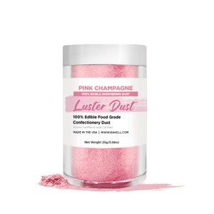 May include: A pink jar of edible luster dust labeled "Pink Champagne 100% Edible Shimmering Dust Luster Dust 100% Edible Food Grade Confectionery Dust Kosher Certified & Halal Certified MADE IN THE USA | WWW.BAKELL.COM Net Weight 25g/0.88oz"