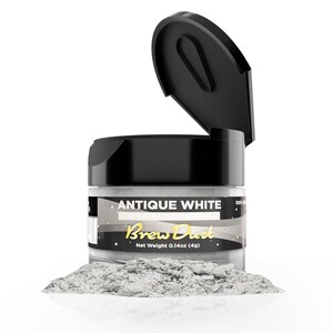 May include: A clear jar of "Antique White" edible dust for drinks, with a black lid. The jar is open, revealing a fine, light gray powder. The label reads "Brew Dust" and the net weight is 0.14oz (4g).