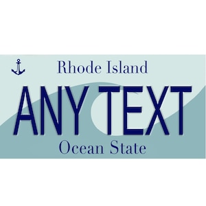 May include: A rectangular license plate design with a light blue background and dark blue text. The text reads "Rhode Island" and "Ocean State" with the words "ANY TEXT" in large letters. An anchor graphic is in the upper left corner.