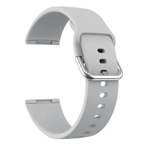 May include: A light gray silicone watch band with a silver buckle. The band has multiple holes for adjusting the fit.