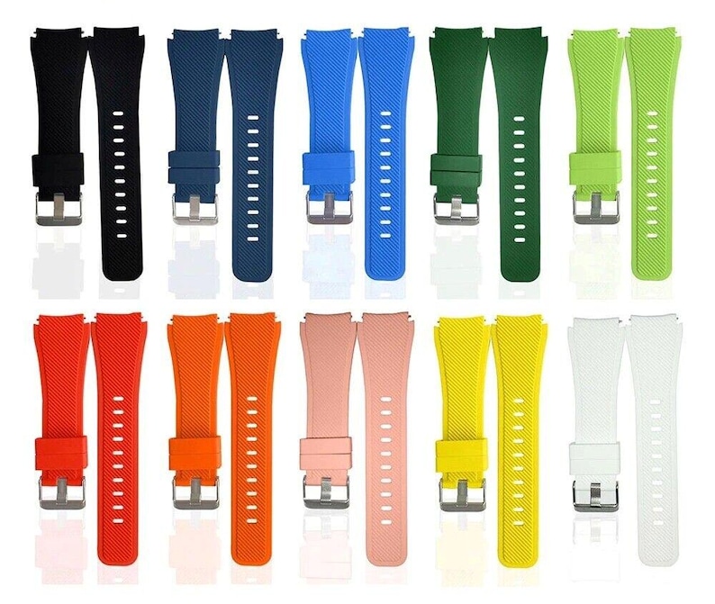 May include: A collection of ten silicone watch bands in various colors including black, navy, blue, green, lime, red, orange, pink, yellow, and white. Each band features a textured diagonal pattern, a silver-toned metal buckle, and a matching loop.