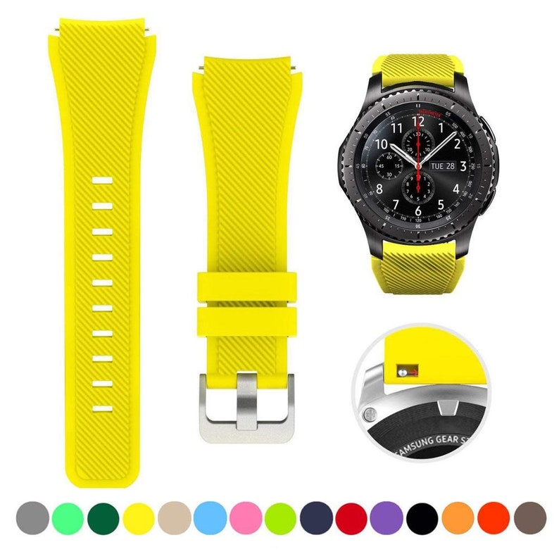 May include: A bright yellow silicone watch strap with a diagonal ribbed texture, featuring a silver-toned metal buckle. The set includes two strap pieces and a black smartwatch with a round face, plus a circular detail showing the quick-release pin.
