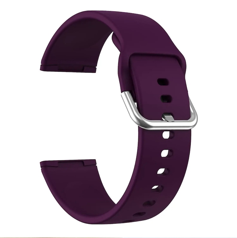 May include: A purple silicone watch band with a silver buckle.
