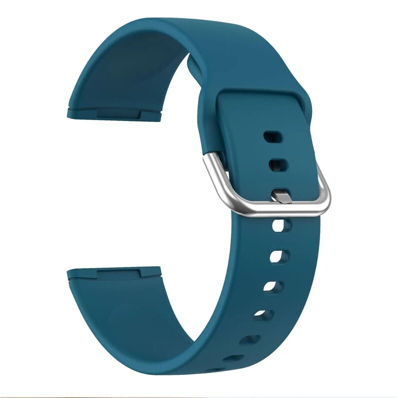 May include: A teal blue silicone watch band with a silver buckle. The band has multiple holes for adjusting the fit.