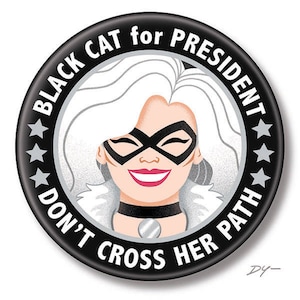 May include: Black and white button with the text "Black Cat for President Don't Cross Her Path" and a cartoon image of Black Cat with a sly smile.