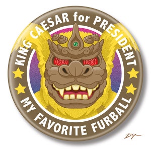 May include: A brown and yellow button with a cartoon monster face and the text "KING CAESAR for PRESIDENT MY FAVORITE FURBALL".