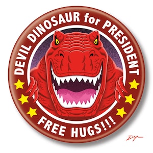 May include: Red button with a cartoon dinosaur with the text "Devil Dinosaur for President" and "Free Hugs!!" in a white circle.