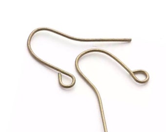 May include: Two gold-toned earring hooks, each with a small loop at the end.