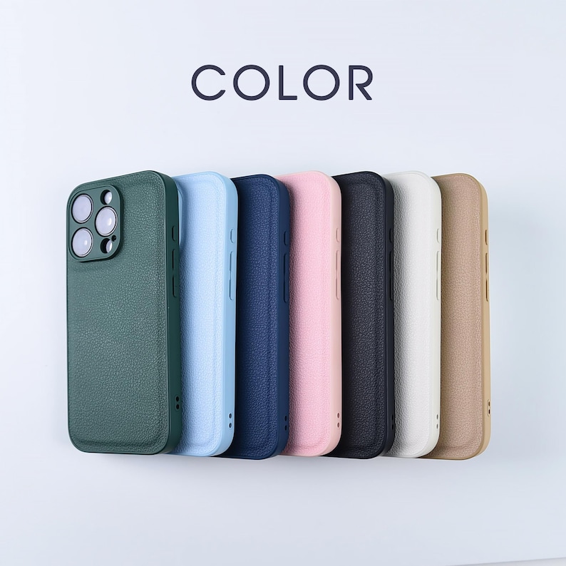 May include: A collection of seven smartphone cases with a textured finish, arranged in a row. The colours include dark green, light blue, navy blue, light pink, black, white, and tan. The word COLOR is printed in dark text above the cases.
